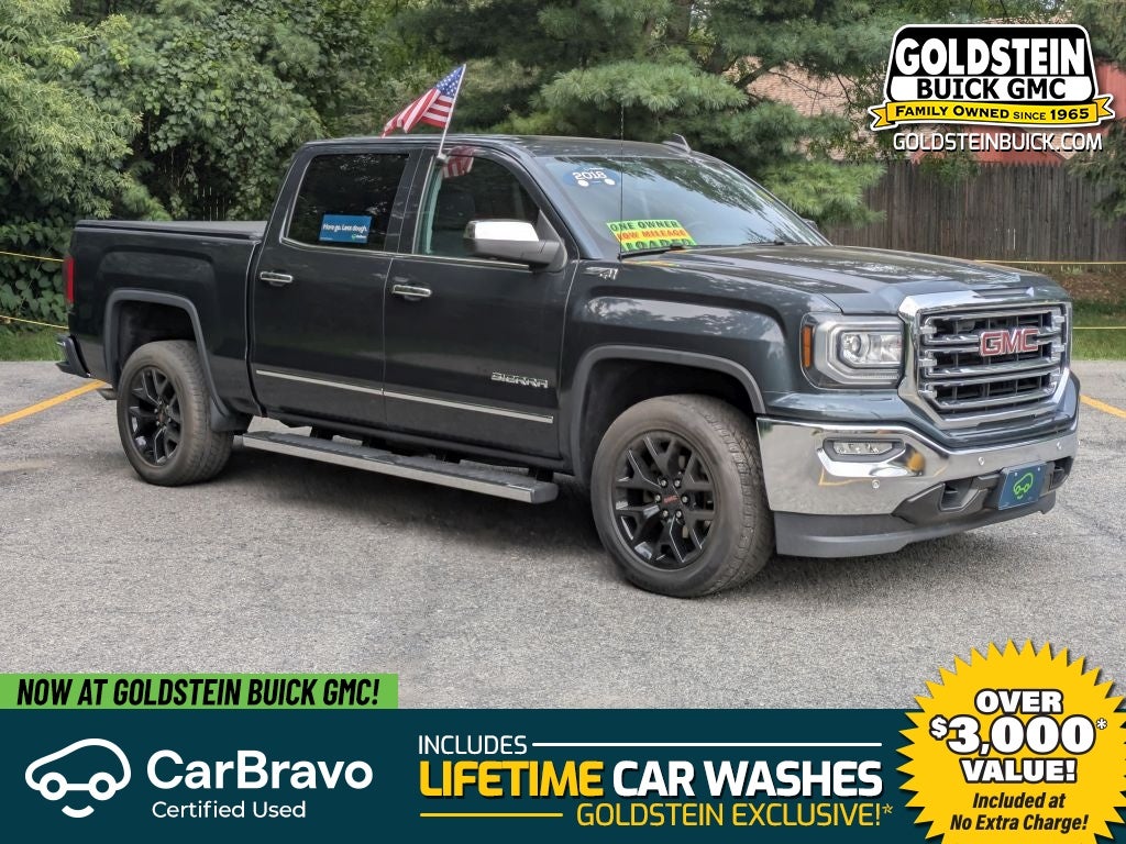 2018 GMC Sierra 1500 SLT in Dark Slate Metallic — front three-quarter view