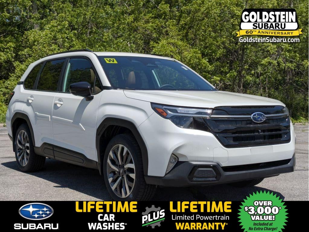 2026 Subaru FORESTER Touring in Crystal White Pearl — front three-quarter view