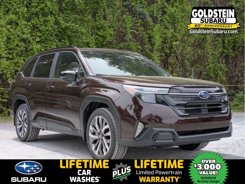 2026 Subaru FORESTER Touring in Dark Mahogany Pearl — front three-quarter view