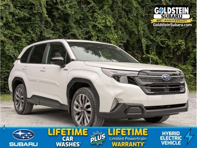 2026 Subaru FORESTER Touring Hybrid in Crystal White Pearl — front three-quarter view