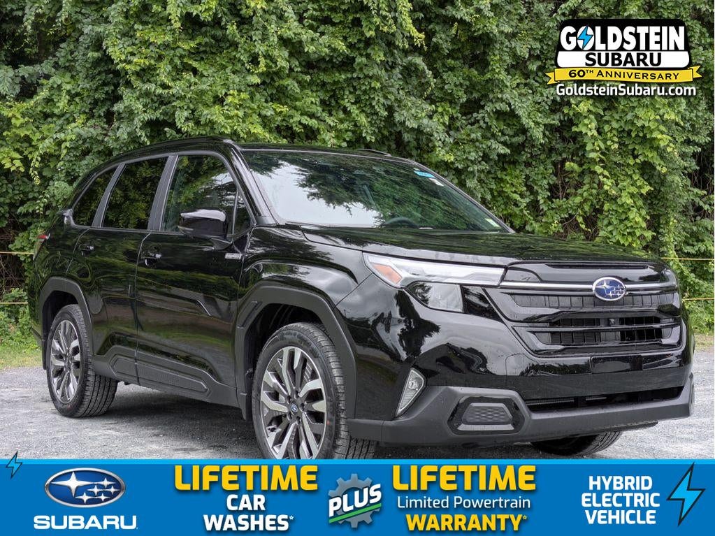 2026 Subaru FORESTER Touring Hybrid in Crystal Black Silica — front three-quarter view