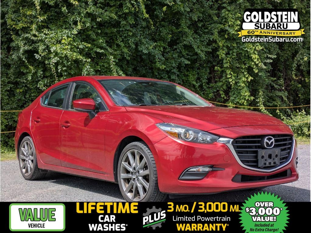 2018 Mazda Mazda3 Touring in Soul Red Metallic — front three-quarter view