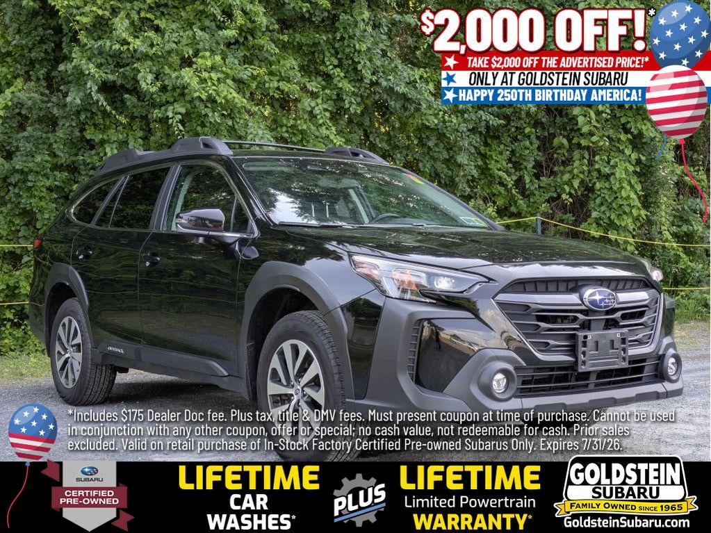 2023 Subaru Outback Premium in Crystal Black Silica — front three-quarter view
