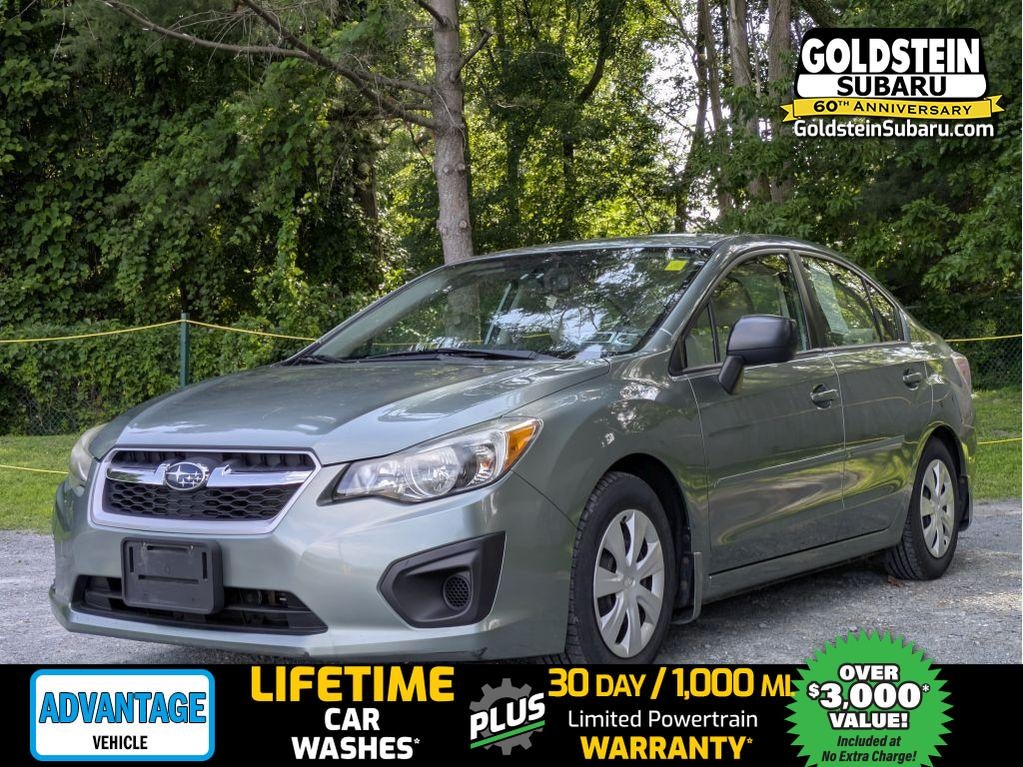 2014 Subaru Impreza 2.0i (CVT) in Jasmine Green Metallic — front three-quarter view