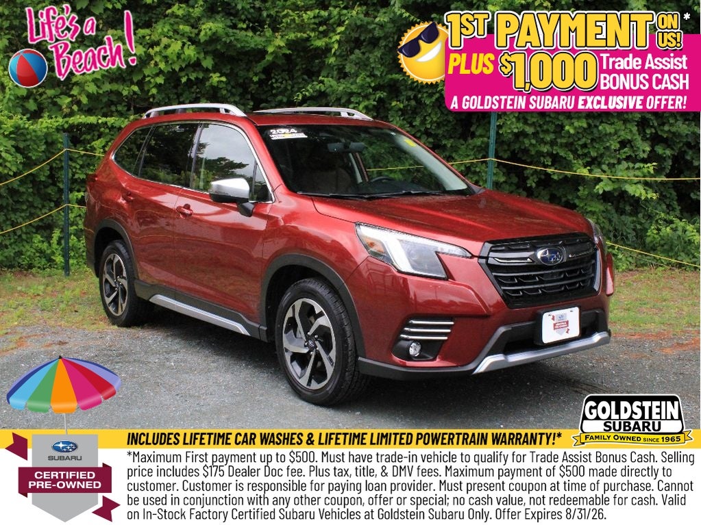 2024 Subaru Forester Touring in Crimson Red Pearl — front three-quarter view