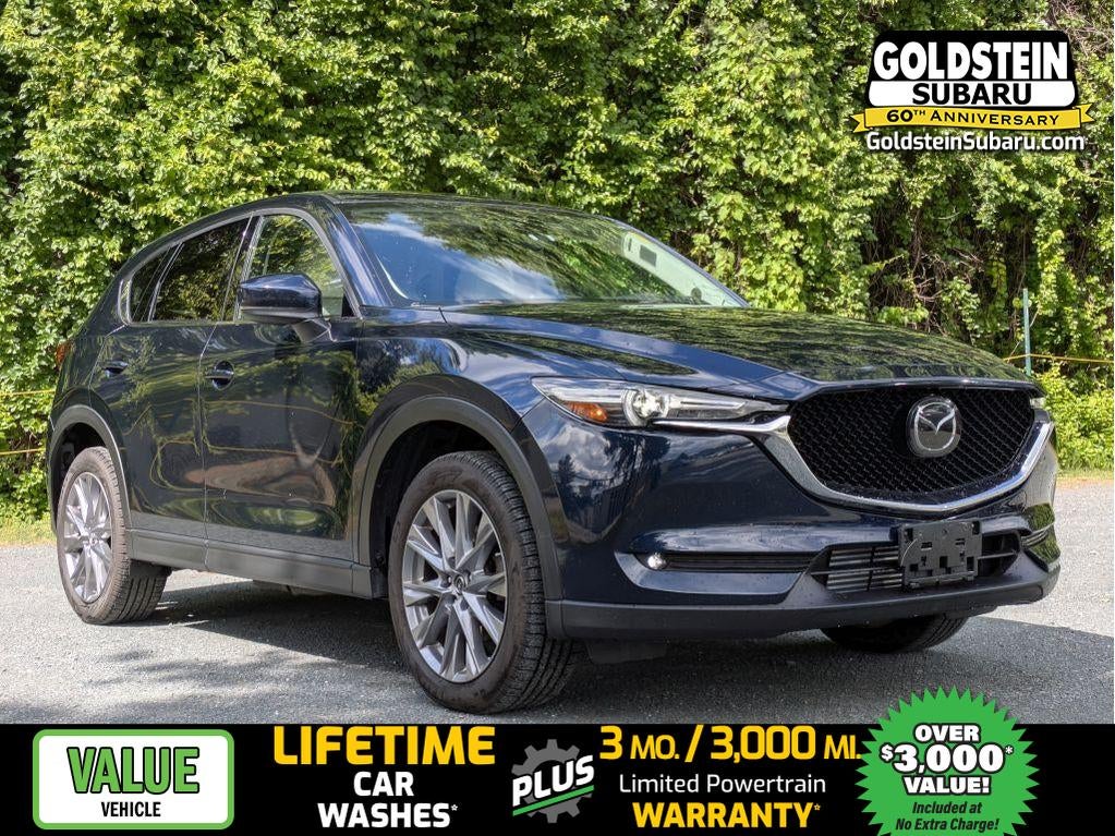 2019 Mazda Mazda CX-5 Grand Touring Reserve in Deep Crystal Blue Mica — front three-quarter view