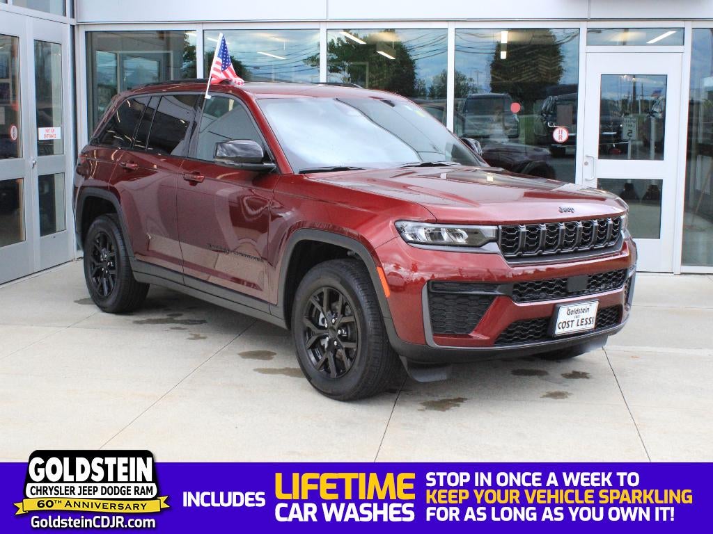2026 Jeep Grand Cherokee Laredo Altitude in Velvet Red Pearlcoat — front three-quarter view