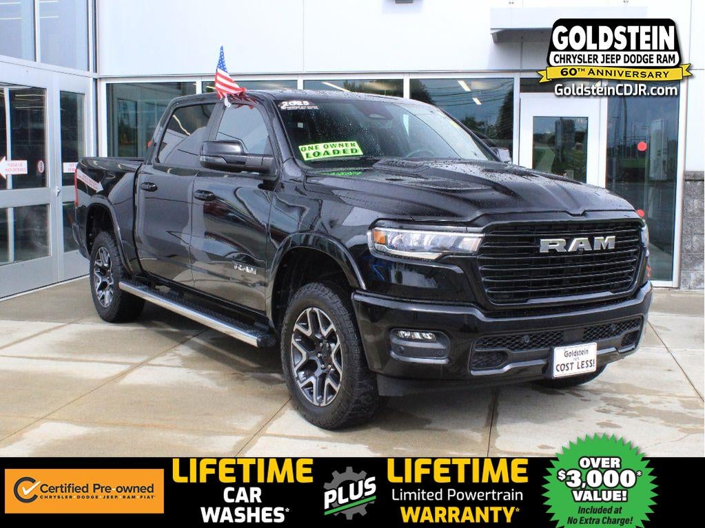 2025 RAM 1500 Laramie in Diamond Black Crystal Pearlcoat — front three-quarter view